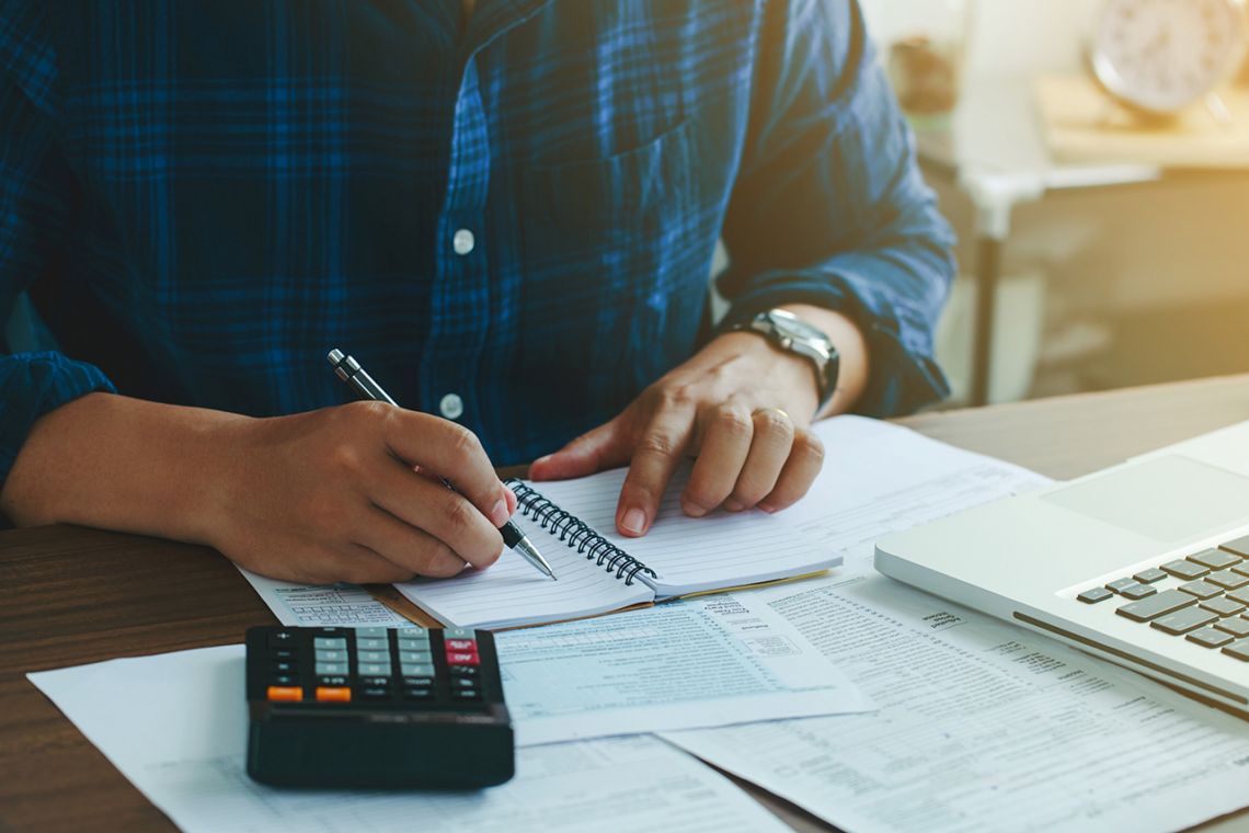 man with financing paperwork