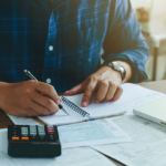 man with financing paperwork