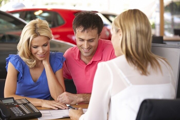 couple reading Lexus financing documents