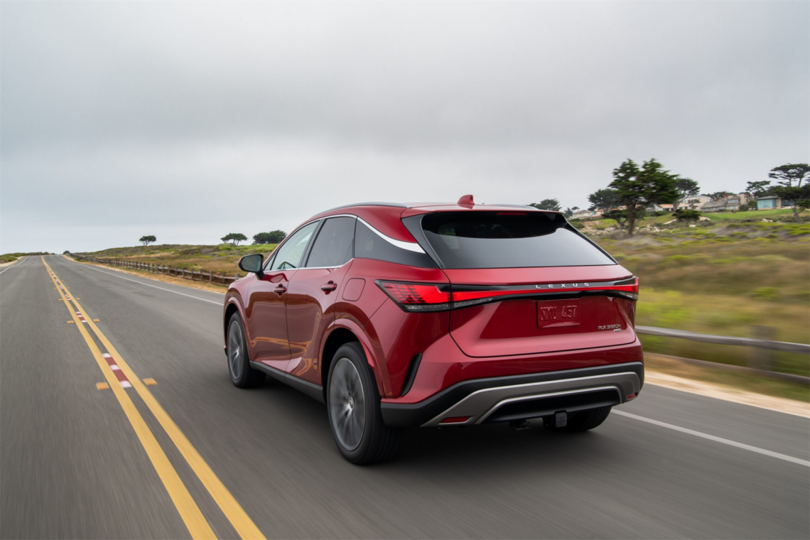 Red 2026 Lexus RX Hybrid on the road