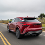 Red 2026 Lexus RX Hybrid on the road